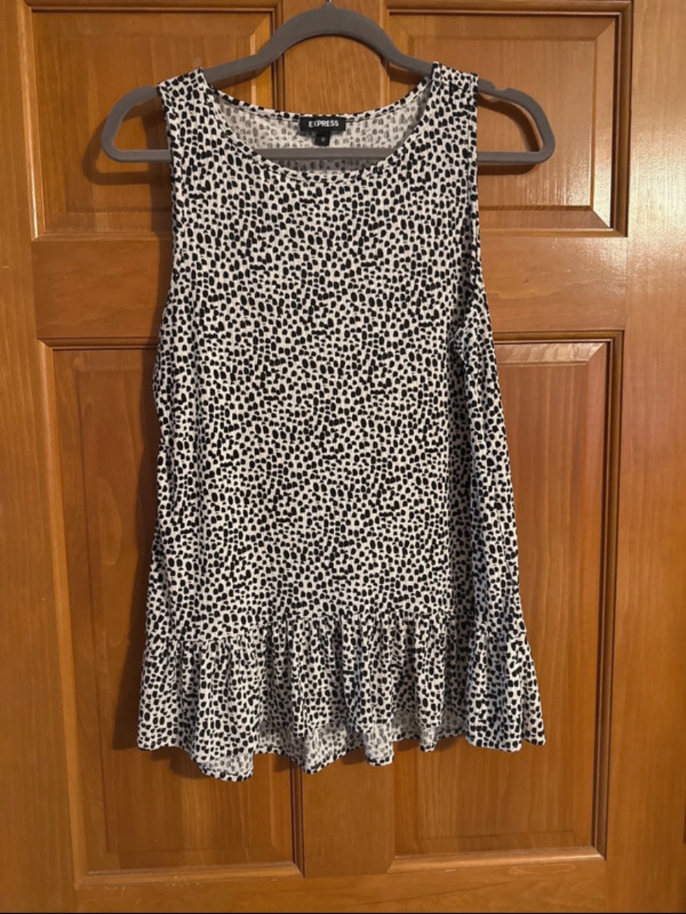 EUC express ribbee peplum sleeveless top size M